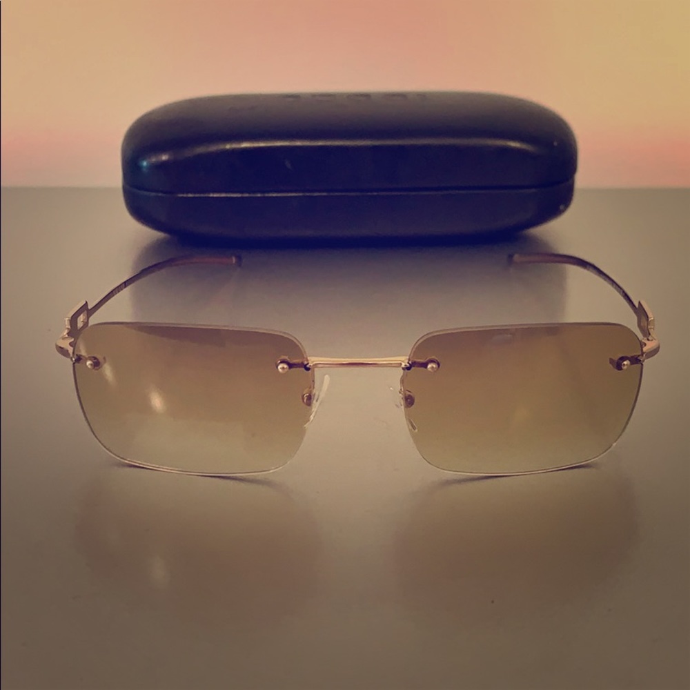 Gucci Sunglasses with rhinestones on the side